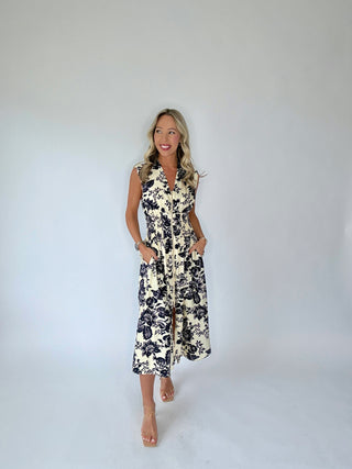Woman wearing a floral dress against a white background