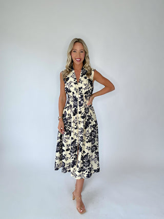 Woman wearing a floral dress against a white background