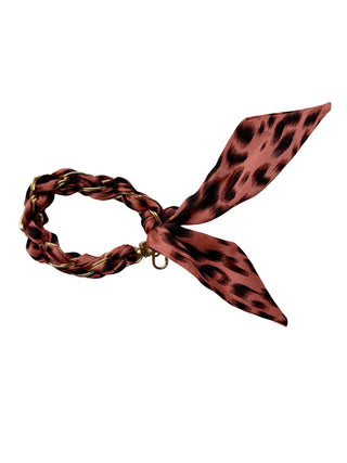 Leopard print hair scarf on a white background