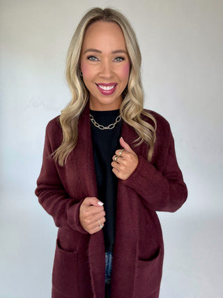 The Stockport Jacket in Aubergine Front Mid Length Smiling Image