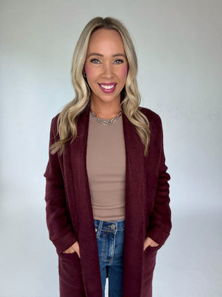 The Stockport Jacket in Aubergine Mid Length Smiling Image
