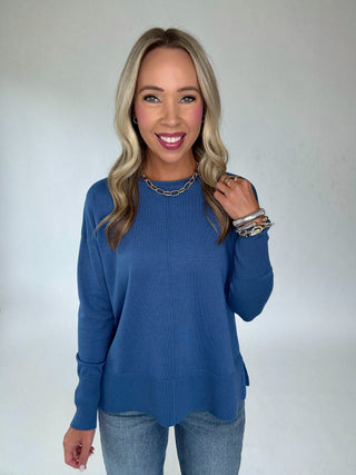 The Whitmore Sweater in French Blue Front Mid Length Smiling Hand Up Image
