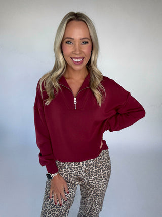 VARLEY Hawley Half Zip New Maroon Front Mid Length Hand on Hip Image